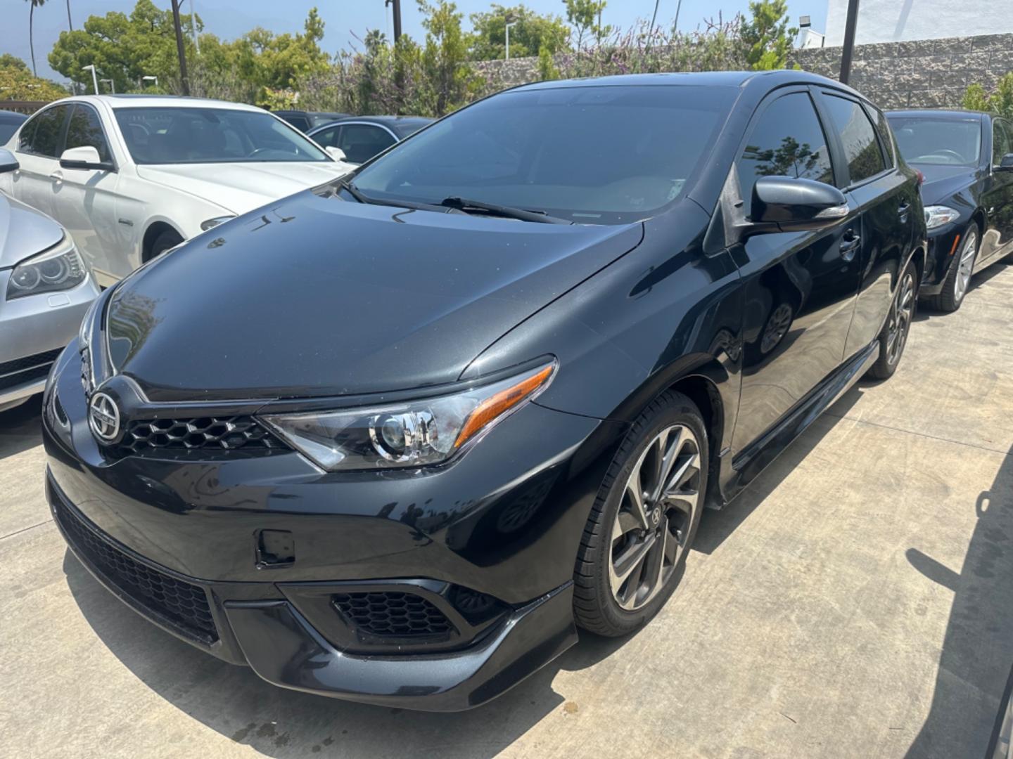 2016 Black /Black Scion iM Cloth (JTNKARJE7GJ) with an 1.8 4 Cylinder engine, Automatic transmission, located at 30 S. Berkeley Avenue, Pasadena, CA, 91107, (626) 248-7567, 34.145447, -118.109398 - 2016 Scion iM 1.8: Your Ideal Pre-Owned Hatchback in Pasadena, CA When searching for used BHPH cars in Pasadena, CA, the 2016 Scion iM 1.8 stands out as a premier choice. This versatile hatchback combines efficiency, style, and practicality, making it a highly sought-after vehicle in the pre-owned - Photo#19